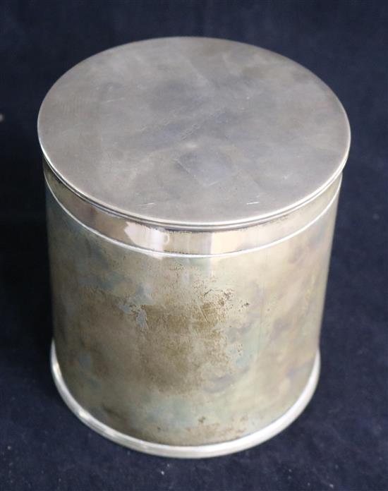 A 1930s silver cylindrical box and cover with engraved inscription, Goldsmiths & Silversmiths Co Ltd, London, 1931, 18.5 oz.